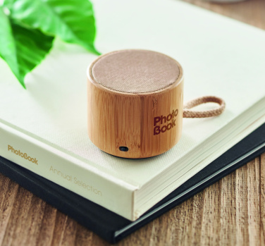 Logotrade promotional giveaways photo of: Round bamboo wireless speaker